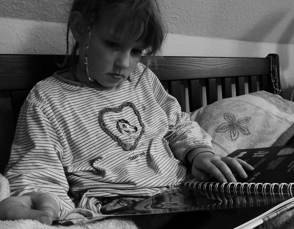 girl relaxing reading at home
