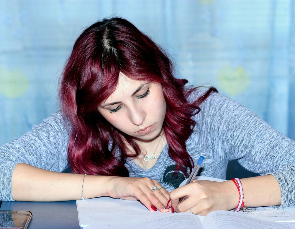 girl working hard at home